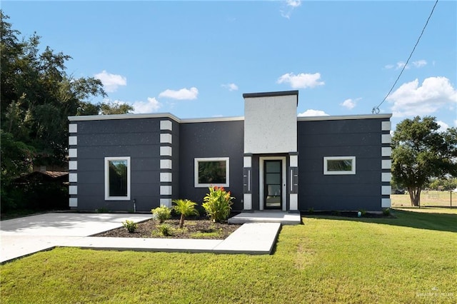 contemporary house with a front yard