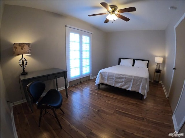 bedroom featuring dark wood finished floors, baseboards, and ceiling fan