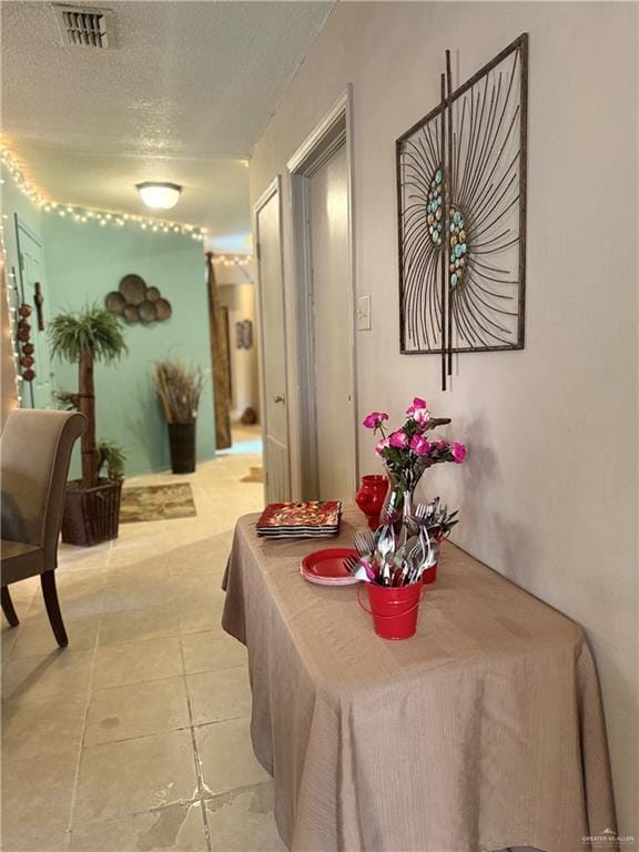 2612 Ashley Dr, Pharr, TX 78577 - dining room with a textured ceiling and light tile patterned flooring