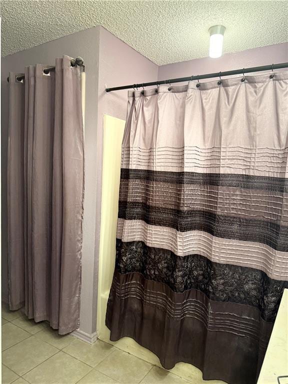 2612 Ashley Dr, Pharr, TX 78577 - full bathroom featuring a textured ceiling, tile patterned floors, and curtained shower