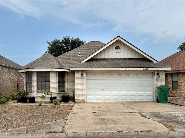 2612 Ashley Dr, Pharr, TX 78577 - ranch-style house featuring brick siding, a garage, and driveway