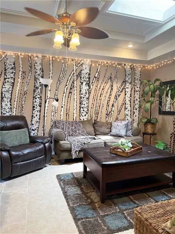 2612 Ashley Dr, Pharr, TX 78577 - living room with ceiling fan, a skylight, tile patterned floors, and recessed lighting