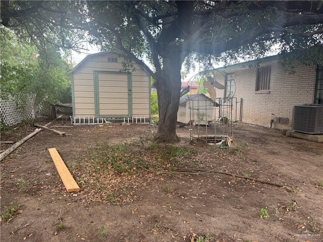 814 N Pino St, Weslaco, TX 78596 - rear view of house featuring cooling unit and brick siding