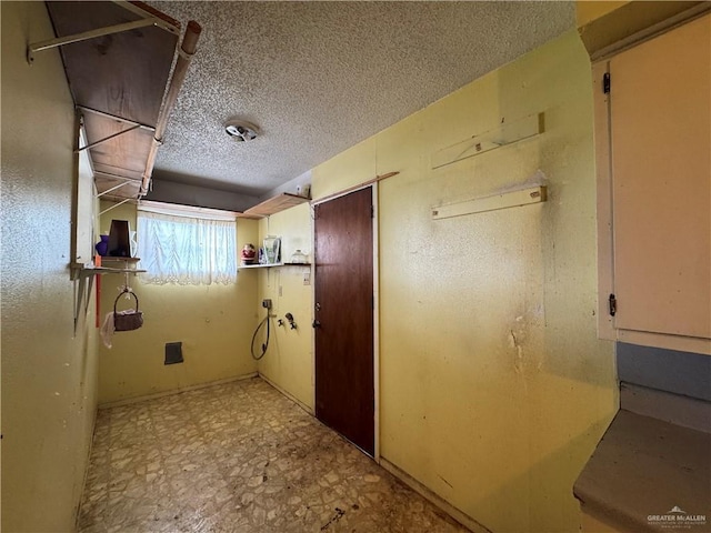 814 N Pino St, Weslaco, TX 78596 - corridor with a textured ceiling and tile patterned floors