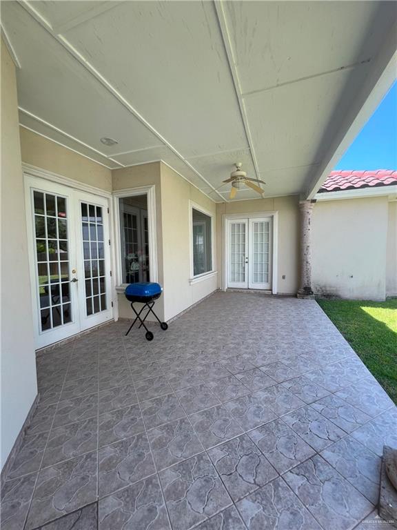 view of patio / terrace featuring ceiling fan and french doors