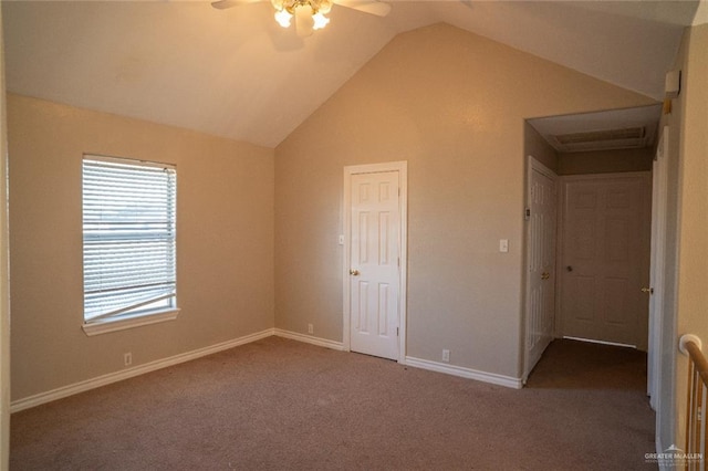 unfurnished bedroom featuring lofted ceiling, carpet, a closet, and ceiling fan