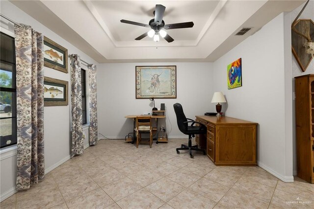 1612 W Military Hwy, Mission, TX 78572 - office with ceiling fan, a tray ceiling, visible vents, light tile patterned flooring, and baseboards