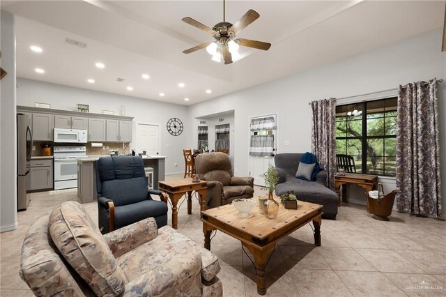 1612 W Military Hwy, Mission, TX 78572 - living area with light tile patterned floors, ceiling fan, visible vents, and recessed lighting