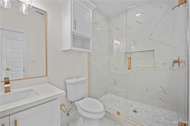 full bathroom with a marble finish shower, baseboards, toilet, marble finish floor, and vanity