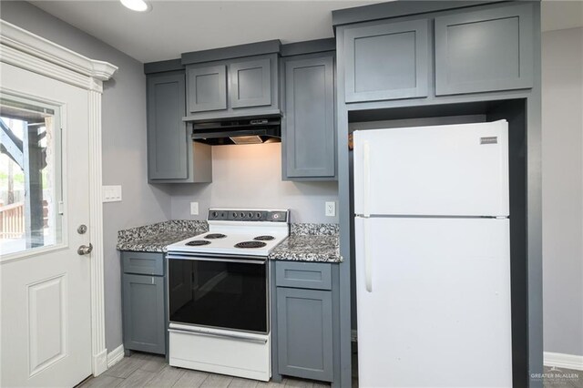 17236 Mandarin Ave, Harlingen, TX 78552 - kitchen with white appliances, under cabinet range hood, gray cabinets, baseboards, and recessed lighting