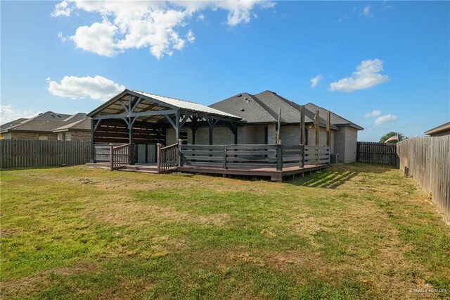 17236 Mandarin Ave, Harlingen, TX 78552 - rear view of property featuring a wooden deck