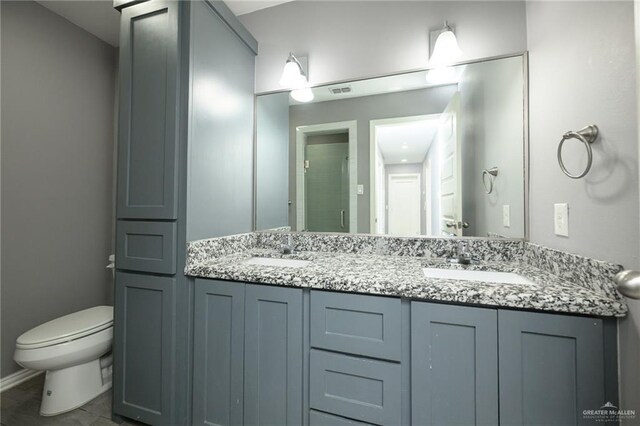 17236 Mandarin Ave, Harlingen, TX 78552 - full bath featuring toilet, double vanity, and an enclosed shower