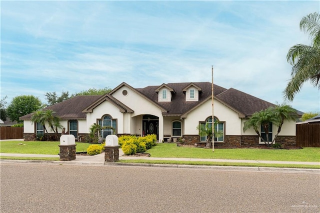 view of front of home featuring a front lawn