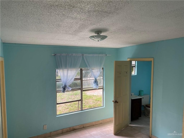 unfurnished bedroom featuring a textured ceiling