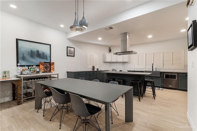 dining area with light hardwood / wood-style floors