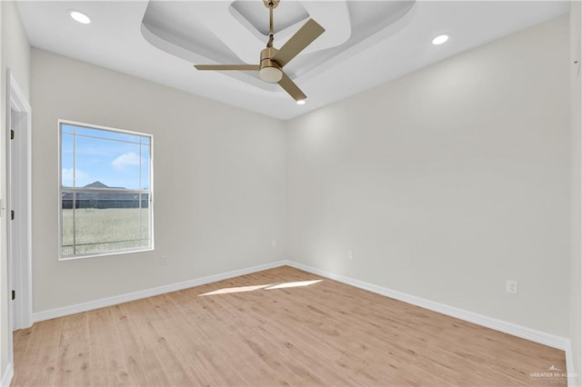 323 Santa Isabel, Rio Grande City, TX 78582 - spare room with light wood-style flooring, baseboards, a ceiling fan, recessed lighting, and a raised ceiling