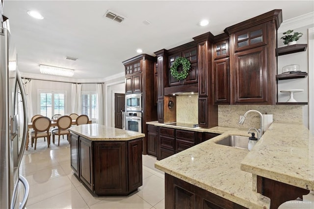 9325 W Mile 8 Rd, Mission, TX 78573 - kitchen featuring a sink, crown molding, stainless steel appliances, a center island, and open shelves