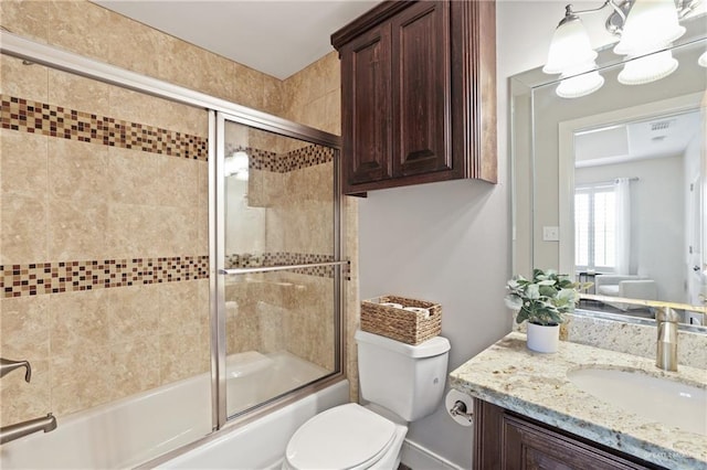 9325 W Mile 8 Rd, Mission, TX 78573 - full bathroom featuring enclosed tub / shower combo, vanity, and toilet