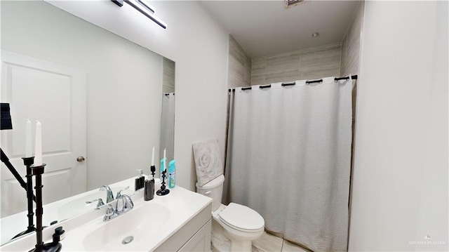 bathroom featuring tile patterned flooring, vanity, a shower with shower curtain, and toilet