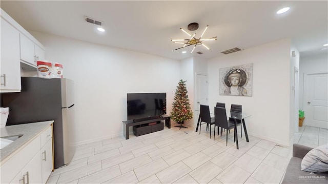 living room with an inviting chandelier