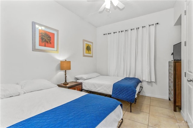 bedroom featuring ceiling fan and light tile patterned flooring