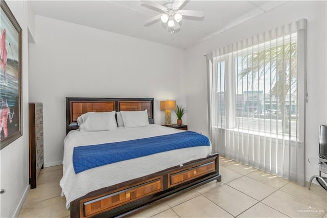 tiled bedroom with ceiling fan