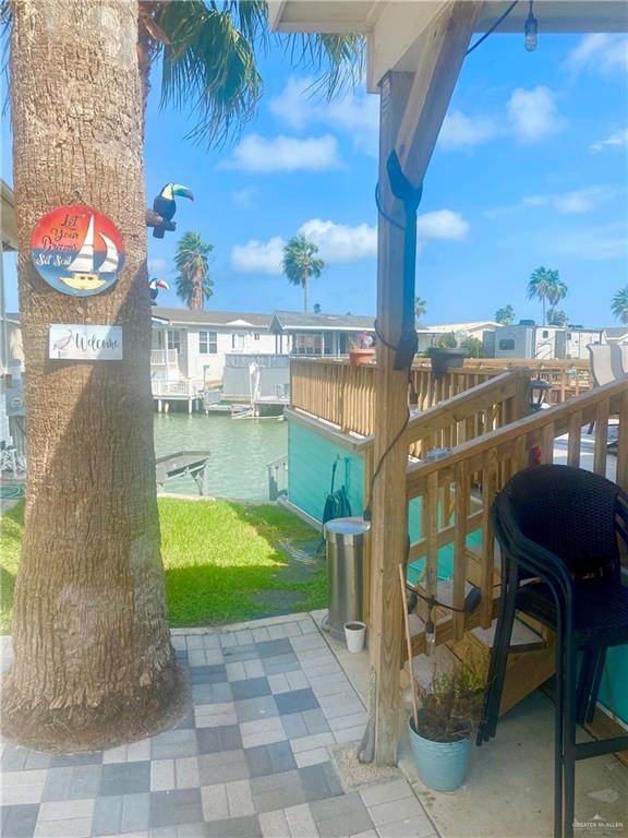 balcony featuring a water view and a boat dock