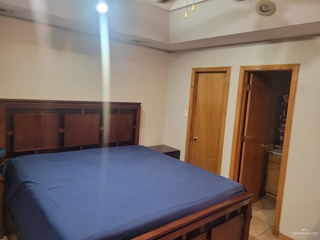 bedroom featuring visible vents and light tile patterned floors