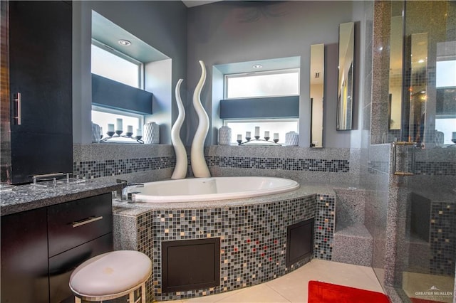 309 N Mockingbird Ave, Mission, TX 78572 - bathroom with a bath and a stall shower