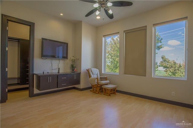 309 N Mockingbird Ave, Mission, TX 78572 - sitting room with light wood finished floors, a ceiling fan, recessed lighting, and baseboards