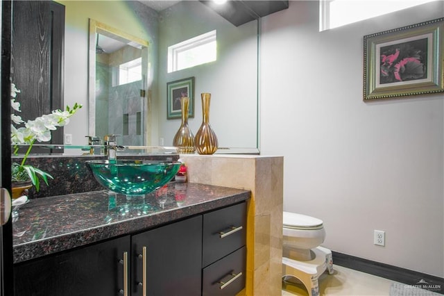 309 N Mockingbird Ave, Mission, TX 78572 - full bathroom with toilet, vanity, and a shower