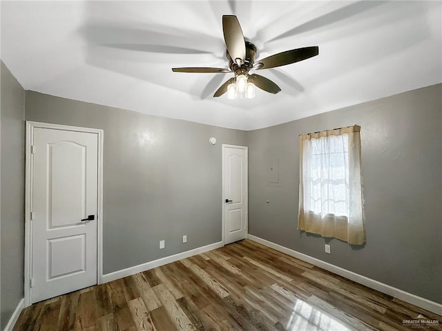 511 W Samano St, Edinburg, TX 78539 - unfurnished room with wood finished floors and a ceiling fan