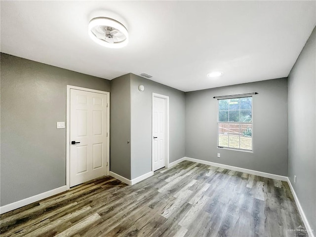 511 W Samano St, Edinburg, TX 78539 - unfurnished bedroom with wood finished floors