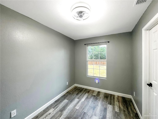 511 W Samano St, Edinburg, TX 78539 - unfurnished room with dark wood-type flooring and baseboards