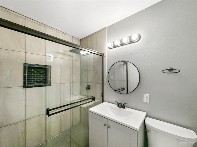511 W Samano St, Edinburg, TX 78539 - bathroom with vanity and a shower stall