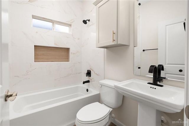 full bathroom featuring toilet, sink, and tiled shower / bath