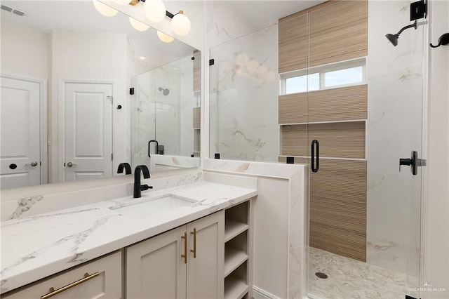 bathroom with vanity and an enclosed shower