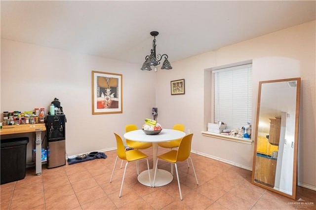 dining space featuring visible vents, baseboards, and light tile patterned floors