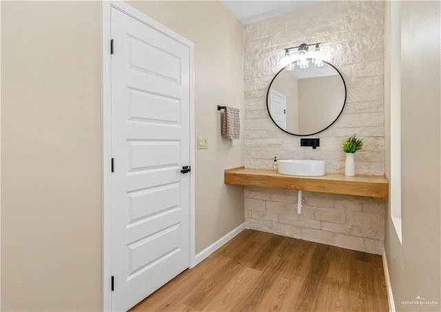 bathroom with sink and hardwood / wood-style flooring