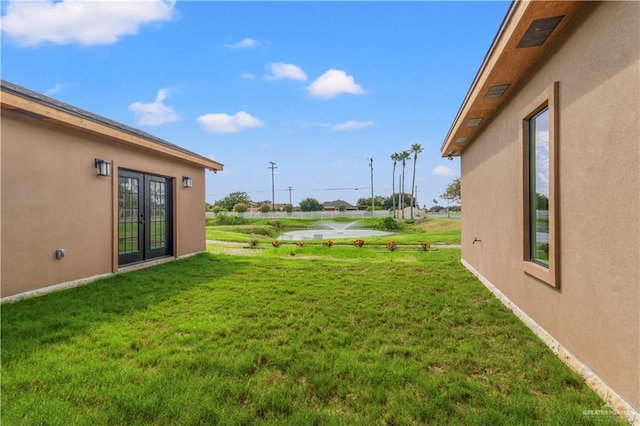 view of yard with french doors