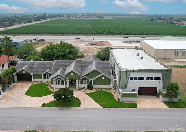 birds eye view of property with a rural view