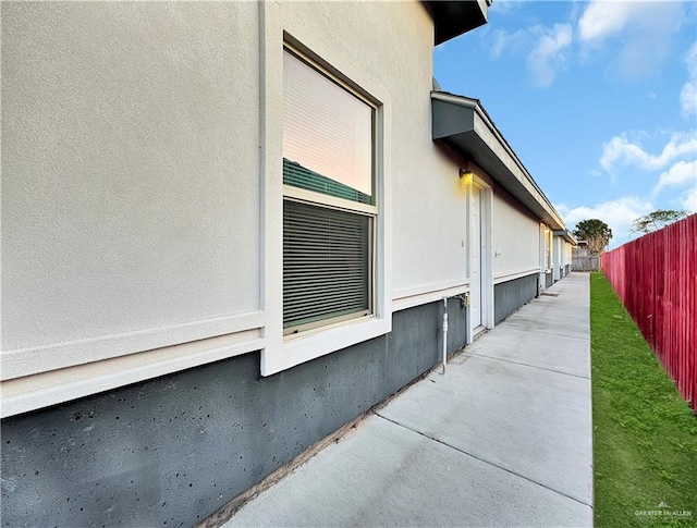 view of side of home with a patio area