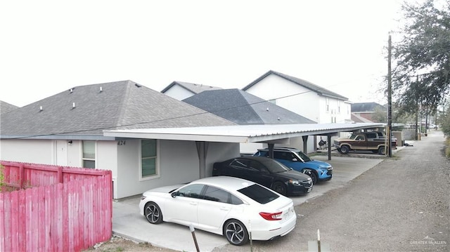 view of vehicle parking featuring a carport