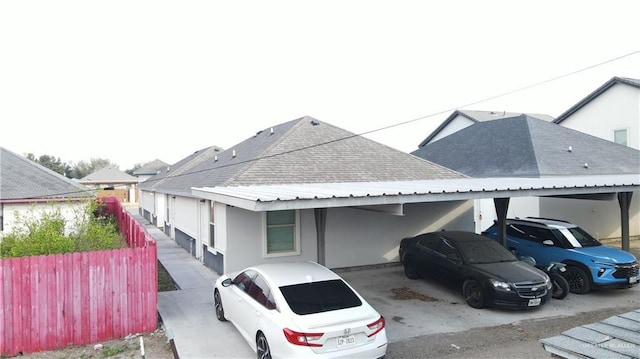 exterior space with a carport