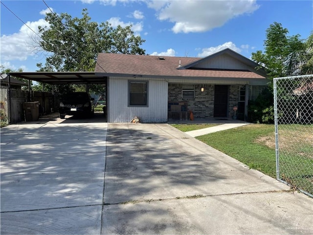 1106 N N Ave N, Donna, TX 78537 - view of front of property with concrete driveway, an attached carport, and roof with shingles
