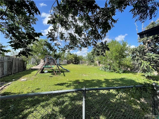 1106 N N Ave N, Donna, TX 78537 - fenced backyard with a playground