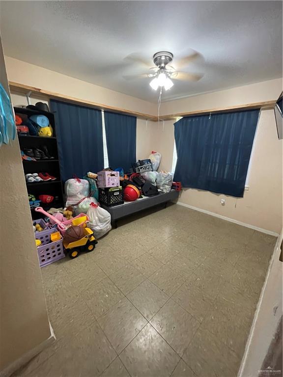 1106 N N Ave N, Donna, TX 78537 - bedroom with a ceiling fan and tile patterned floors
