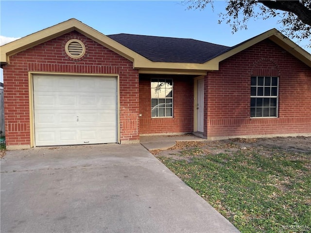 single story home with brick siding, concrete driveway, a garage, and roof with shingles