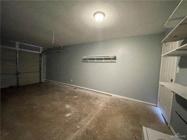 garage featuring baseboards