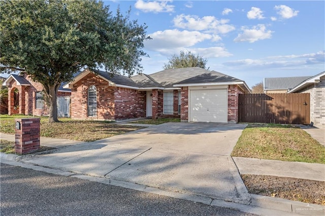 single story home with a garage and a front yard